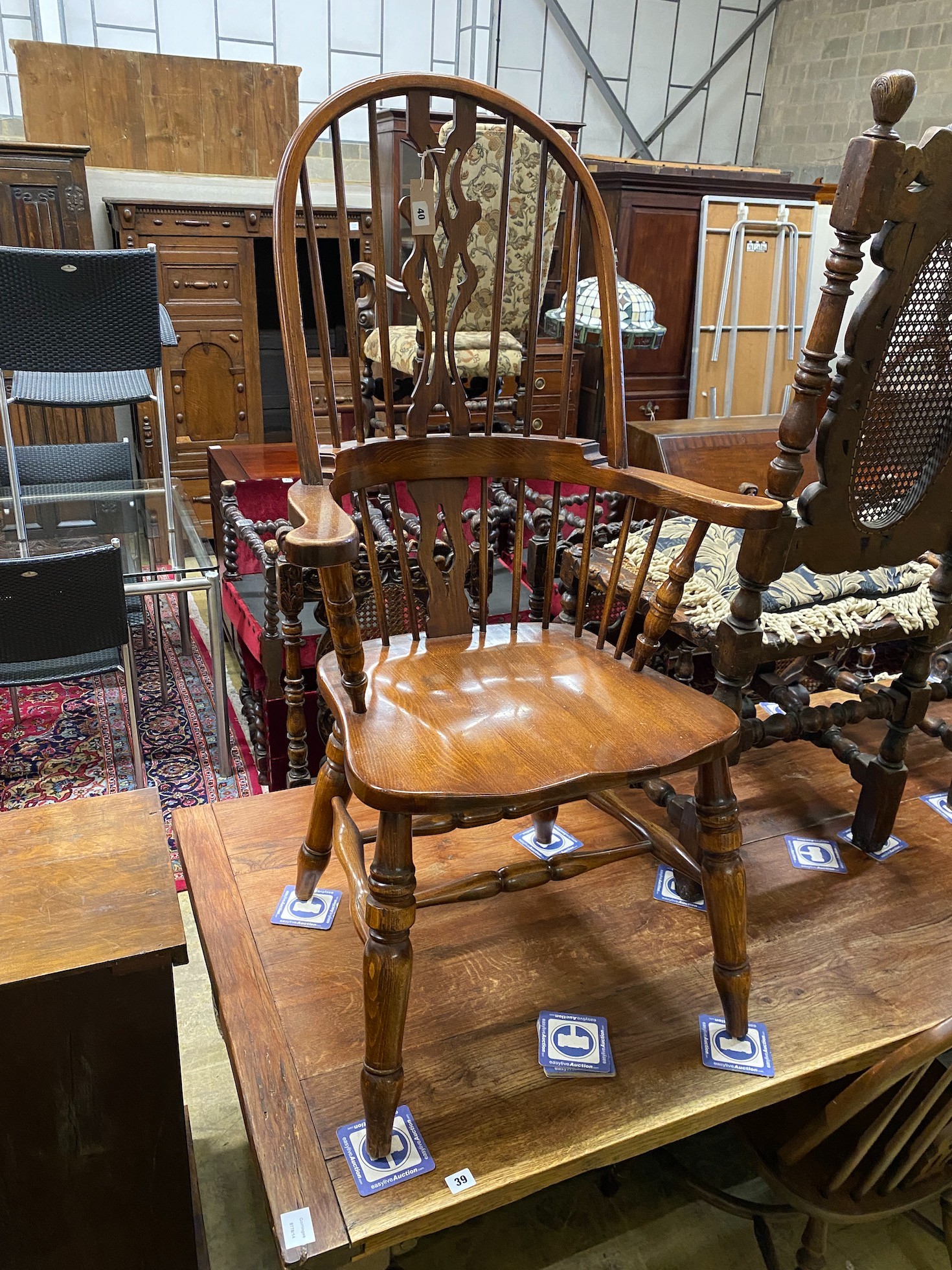 Five reproduction Windsor elm and beech dining chairs, one with arms